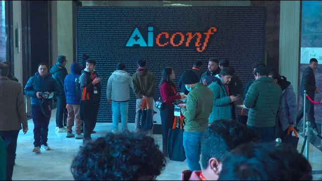 AI Conf Asia 2026 attendees in front of the LED wall